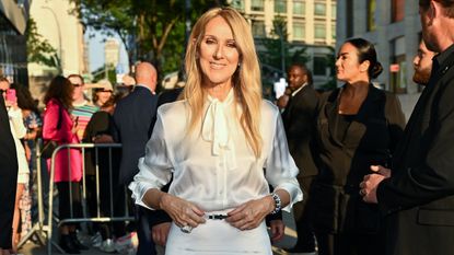 Céline Dion wearing a white button down blouse tucked into a matching maxi skirt at the 'I Am: Celine Dion' New York premiere June 2024