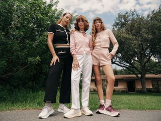 HOKA x Reformation models wearing the new sneakers