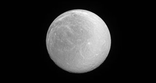 Saturn's icy moon Rhea shines in full sunlight in this new image taken by NASA's Cassini spacecraft on June 3, 2016. NASA released the image on Aug. 1.