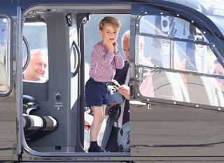 Prince William, Duke of Cambridge, Catherine, Duchess of Cambridge, Prince George of Cambridge and Princess Charlotte of Cambridge view helicopters