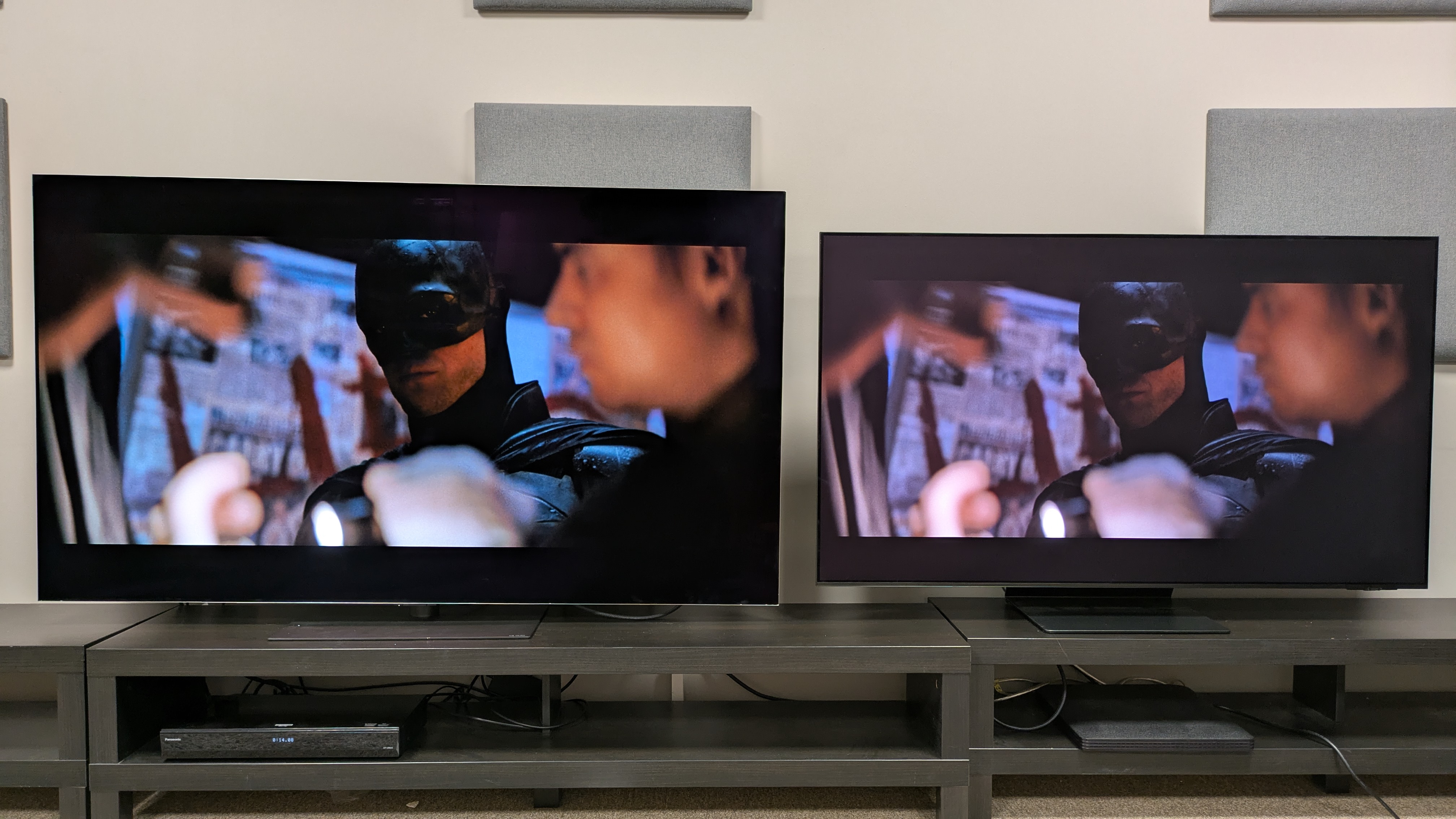 LG G6 (left) and Samsung S95F (right) showing a close-up shot of Batman from The Batman, in which it's possible to see more detail on the LG TV due higher perceived contrast levels