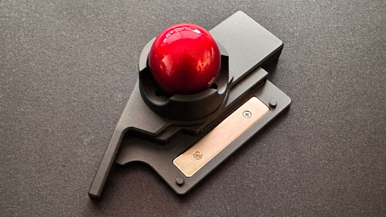 A photo of the ZSA Navigator trackball module