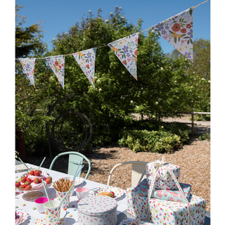 outdoor dining table and hanging bunting flag