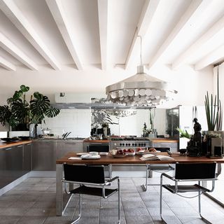 dining area with white ceiling and dining table with chair