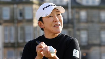 Jiyai Shin signs a golf ball at the 2024 AIG Women&#039;s Open