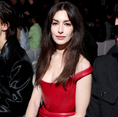 Anne Hathaway in red dress at Versace