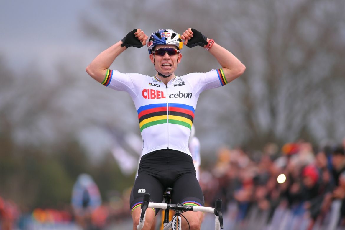 Wout Van Aert sits up and celebrates
