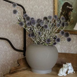Dried flowers in a gray vase