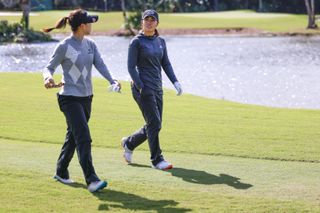 Ko and Kang walk up the fairway