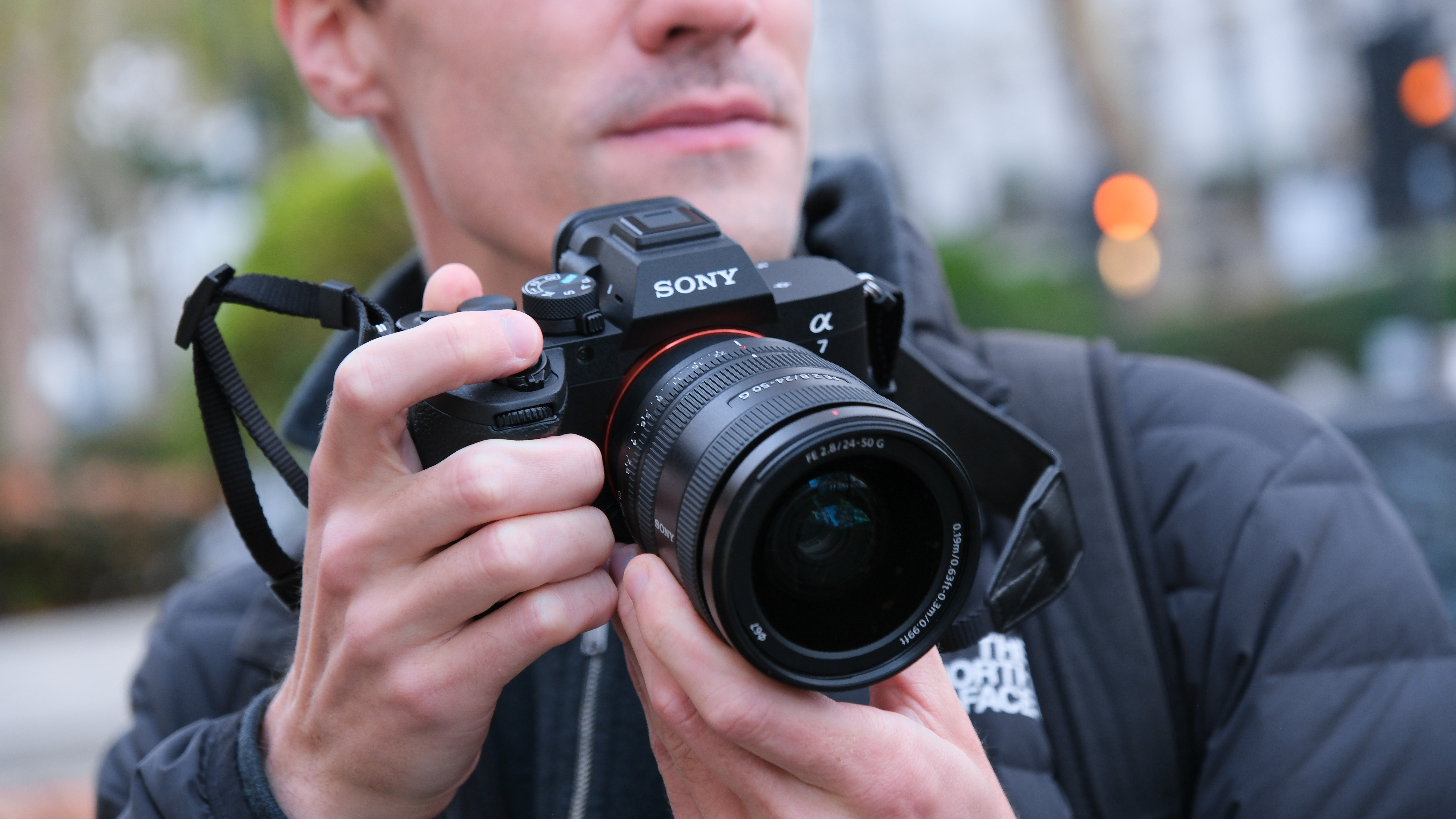 Sony A7 V camera held in a person&#039;s hands