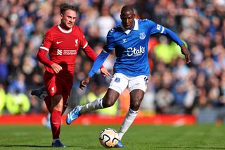 Alexis Mac Allister of Liverpool and Abdoulaye Doucoure of Everton during the Merseyside derby at Anfield in October 2023.