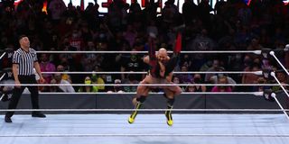 Cesaro performing the Neutralizer on Seth Rollins at WrestleMania 37