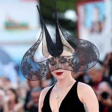 Lady Gaga wears a Philip Treacy headpiece