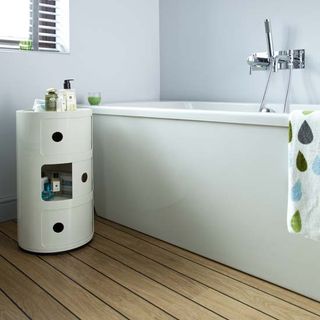 bathroom with white walls and laminate flooring