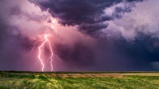 Lightning strike over farmland, USA