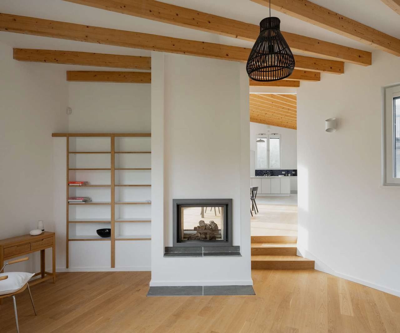 A fireplace in the wall of a white wall