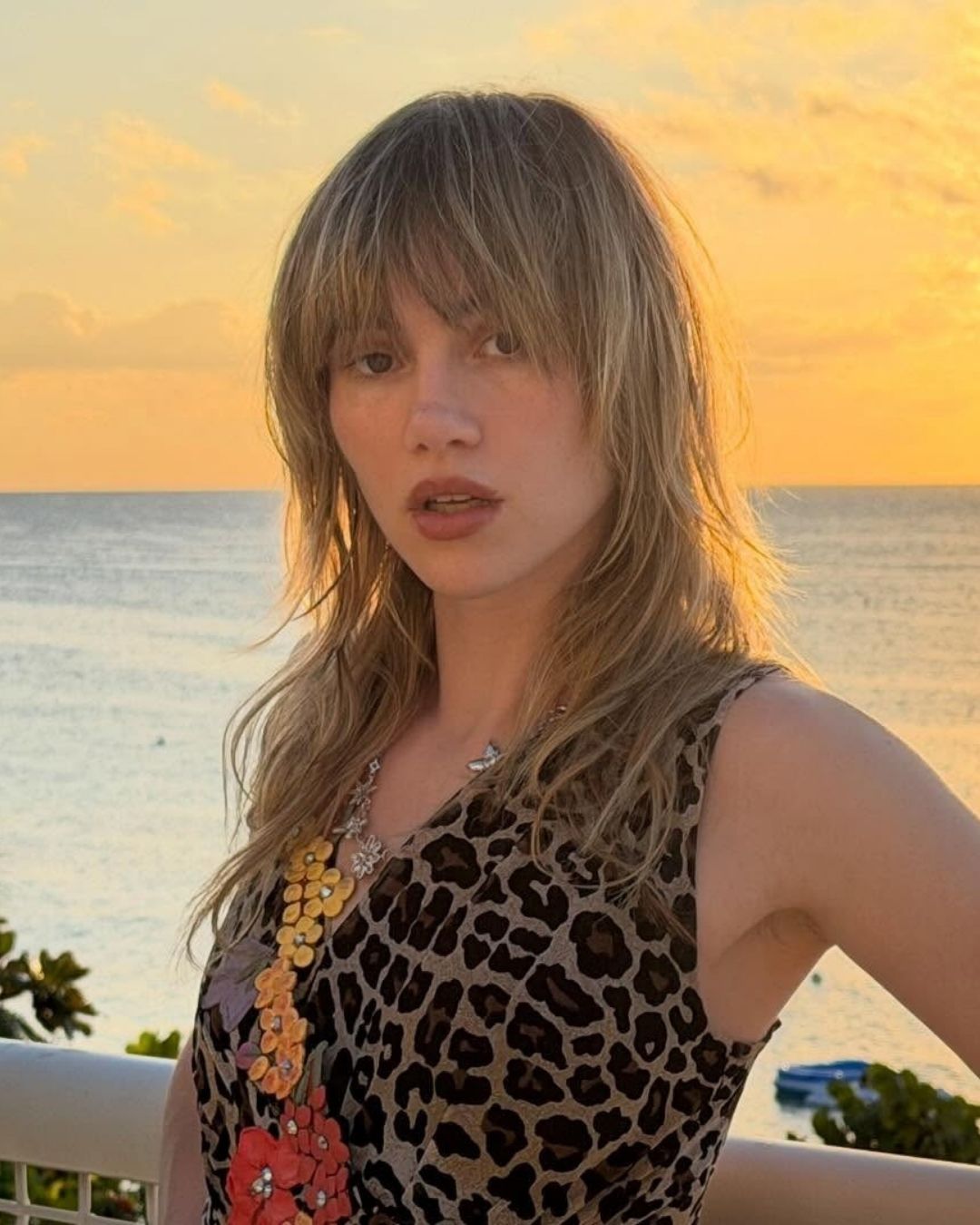 An image of model and singer Suki Waterhouse wearing a sophisticated shag cut.