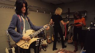 Joe Perry, with a BC Rich Mockingbird guitar, Tom Hamilton and Joey Kramer of Aerosmith backstage at Madison Square Garden in New York City on May 10, 1976.
