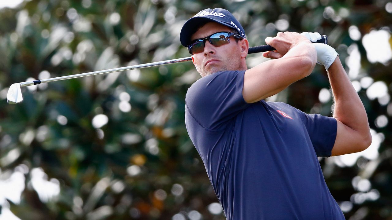 Adam Scott plays his tee shot from the first hole of his opening round of the 2014 Arnold Palmer Invitational