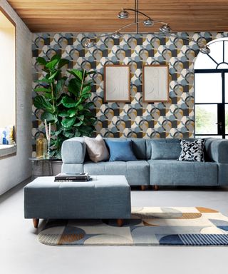 A living room with geometric wallpaper wallcovering and matching rug