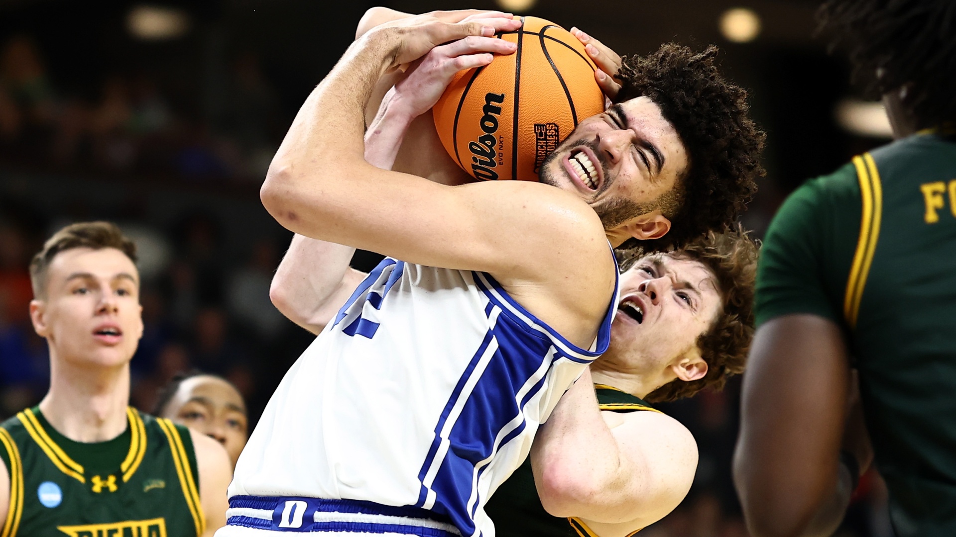 Cameron Boozer of the Duke Blue Devils battling Riley Mulvey of the Siena Saints for the ball at March Madness 2026