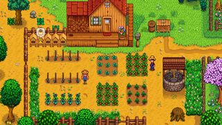 Stardew Valley screenshot - farmer standing next to a well near his field and house
