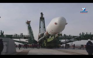 The Soyuz and the OneWeb satellites were hauled to an assembly and testing facility at Baikonur, Russian space officials said.