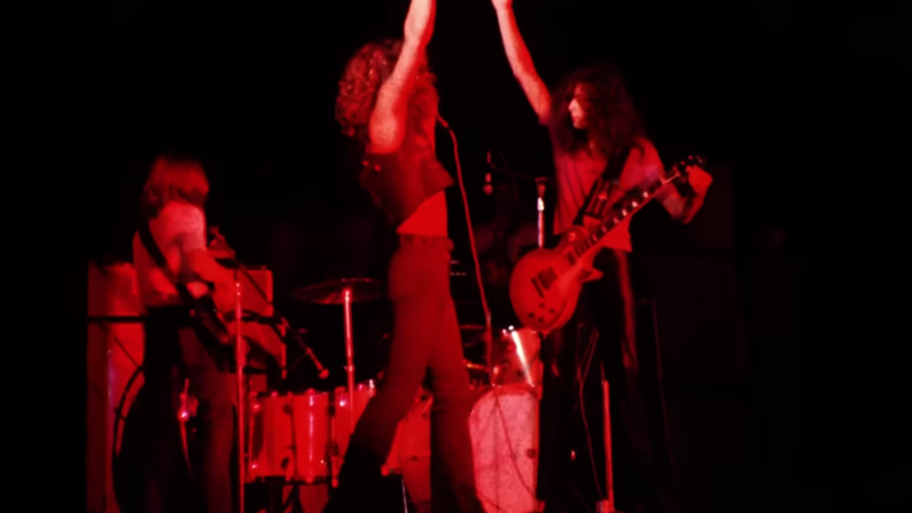 Led Zeppelin drenching in red light in archival concert footage