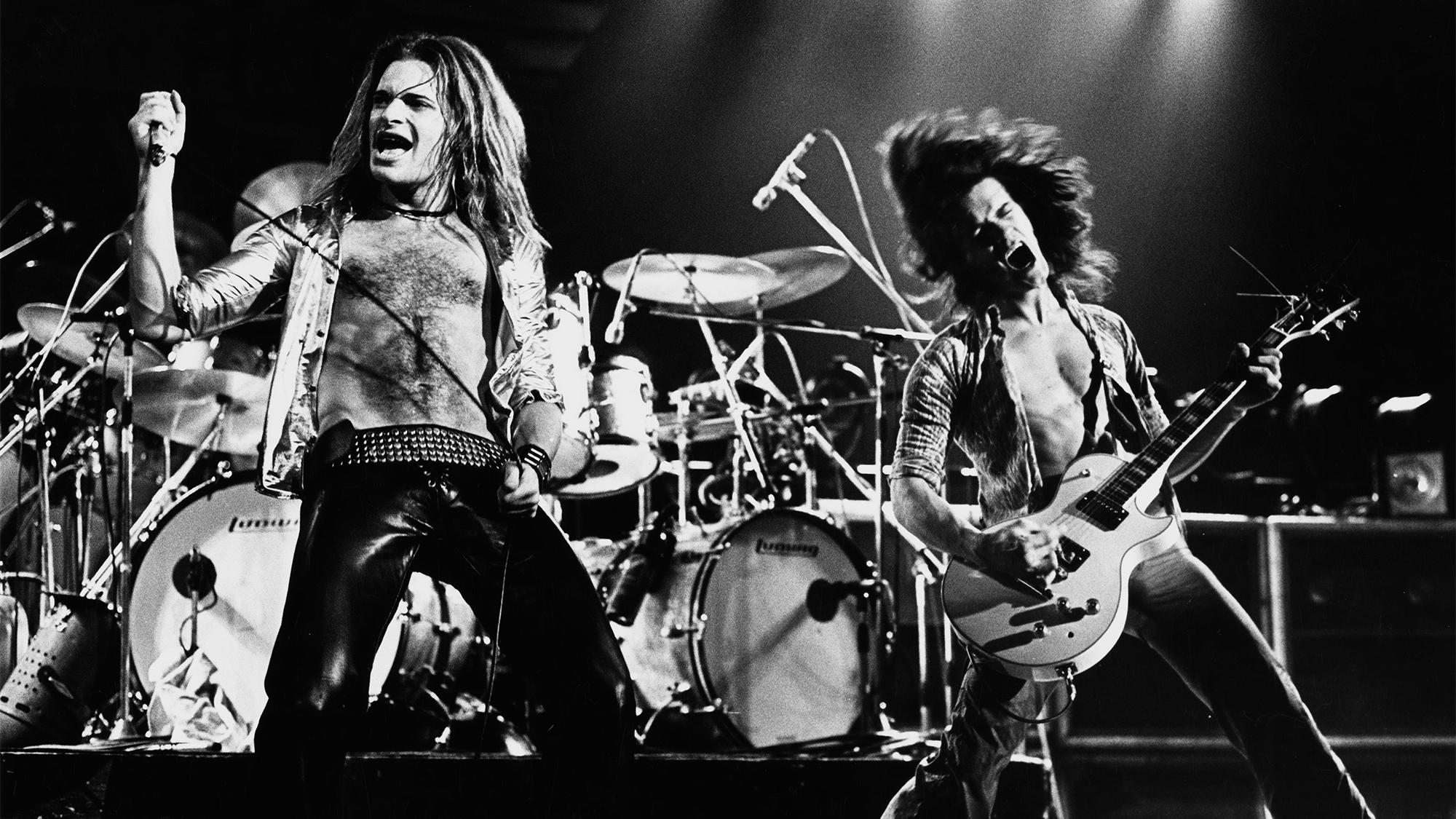 American singer-songwriter and musician David Lee Roth and Dutch-American musician, songwriter, producer, and inventor Eddie Van Halen performing live with rock band Van Halen, 1978.