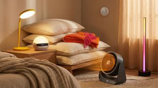 Collage of gadgets in a warm room, with pillows and throws