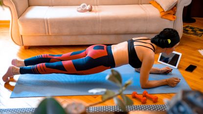 Woman doing a plank at home
