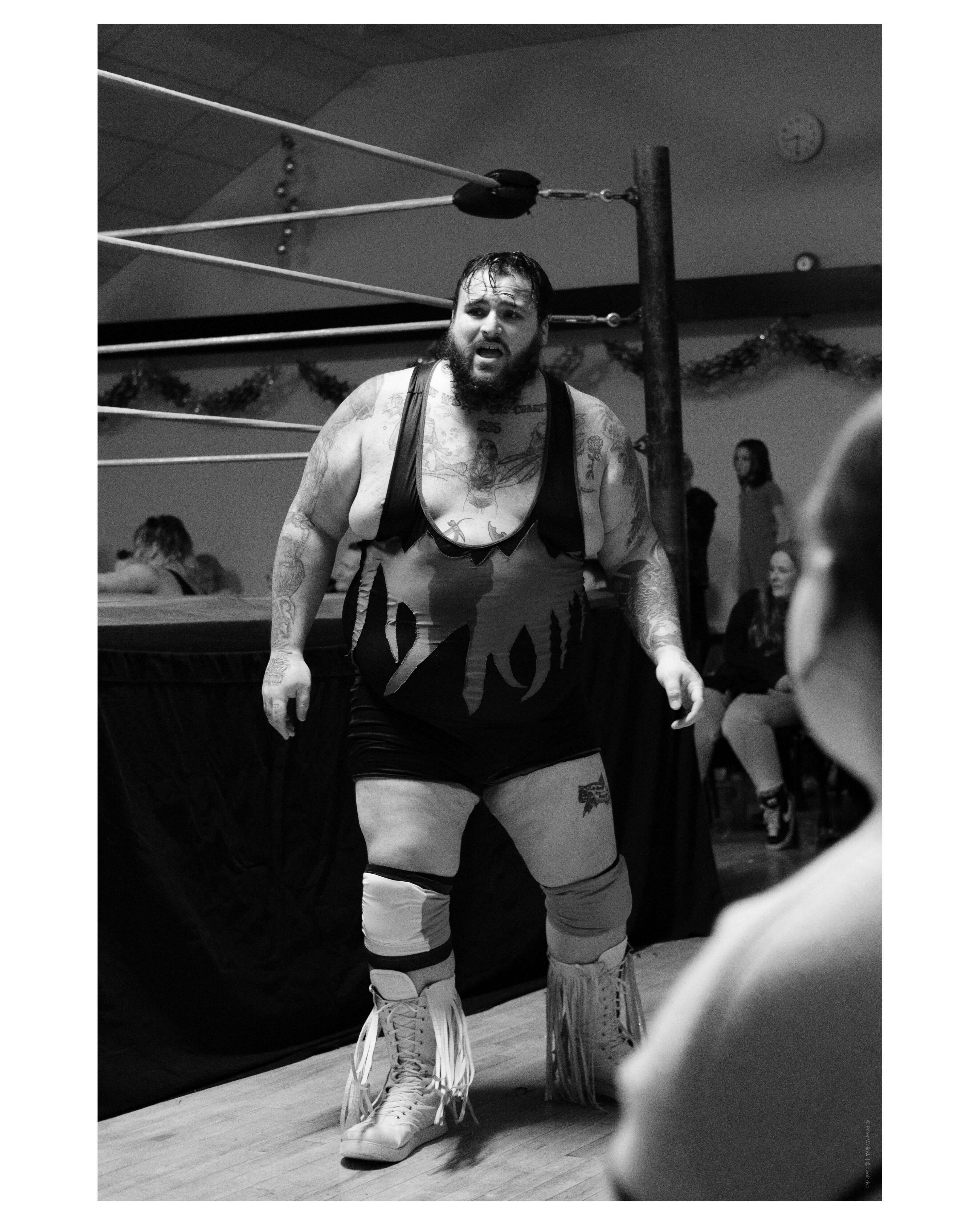 Black and white photo of a wrestling match