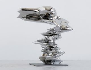 Asymmetrical object in glossy silver