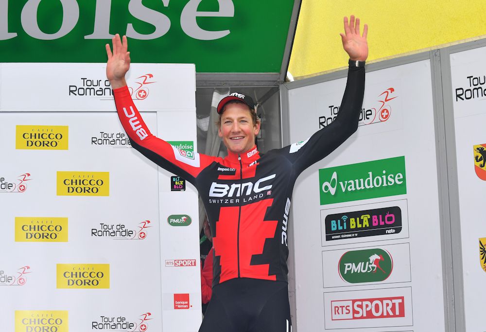 Stefan kung on the podium after winning stage 2 at the Tour de Romandie