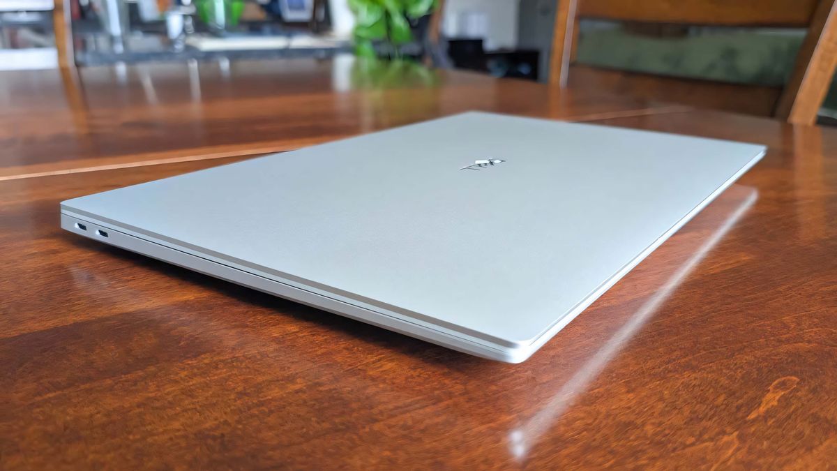 Dell 16 Premium closed on a wooden table.