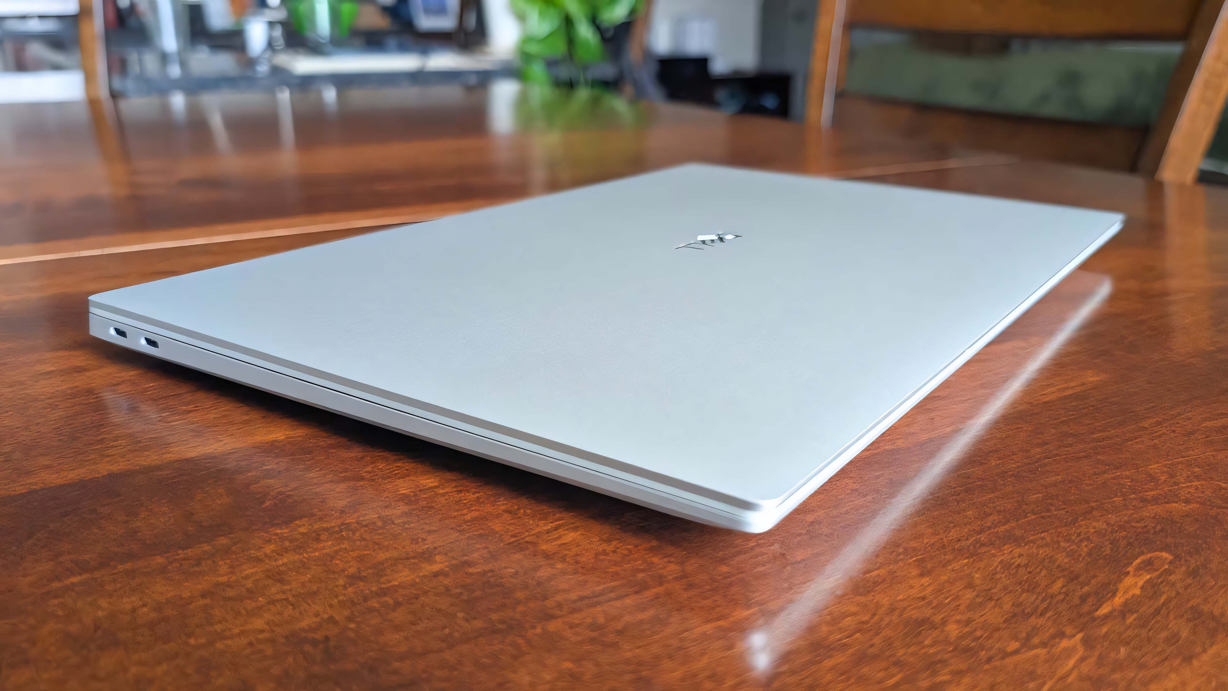 Dell 16 Premium closed on a wooden table.