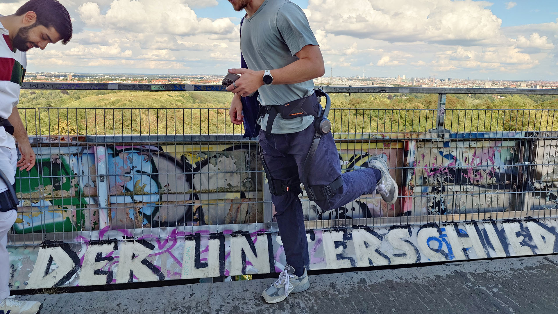 A person stretching while wearing the Hypershell X Ultra.