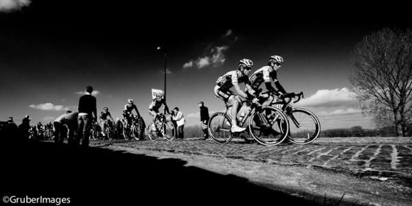 Omega-Pharma Quickstep take charge of the bunch on the first cobbled section