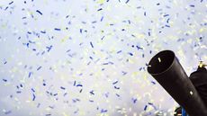 Cannon shoots confetti into the air