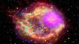 New images from NASA's Fermi Gamma-ray Space Telescope show where supernova remnants emit radiation a billion times more energetic than visible light. The images bring astronomers a step closer to understanding the source of some of the universe's most energetic particles -- cosmic rays. This composite shows the Cassiopeia A supernova remnant across the spectrum: Gamma rays (magenta) from NASA's Fermi Gamma-ray Space Telescope; X-rays (blue, green) from NASA's Chandra X-ray Observatory; visible light (yellow) from the Hubble Space Telescope; infrared (red) from NASA's Spitzer Space Telescope; and radio (orange) from the Very Large Array near Socorro, N.M. 