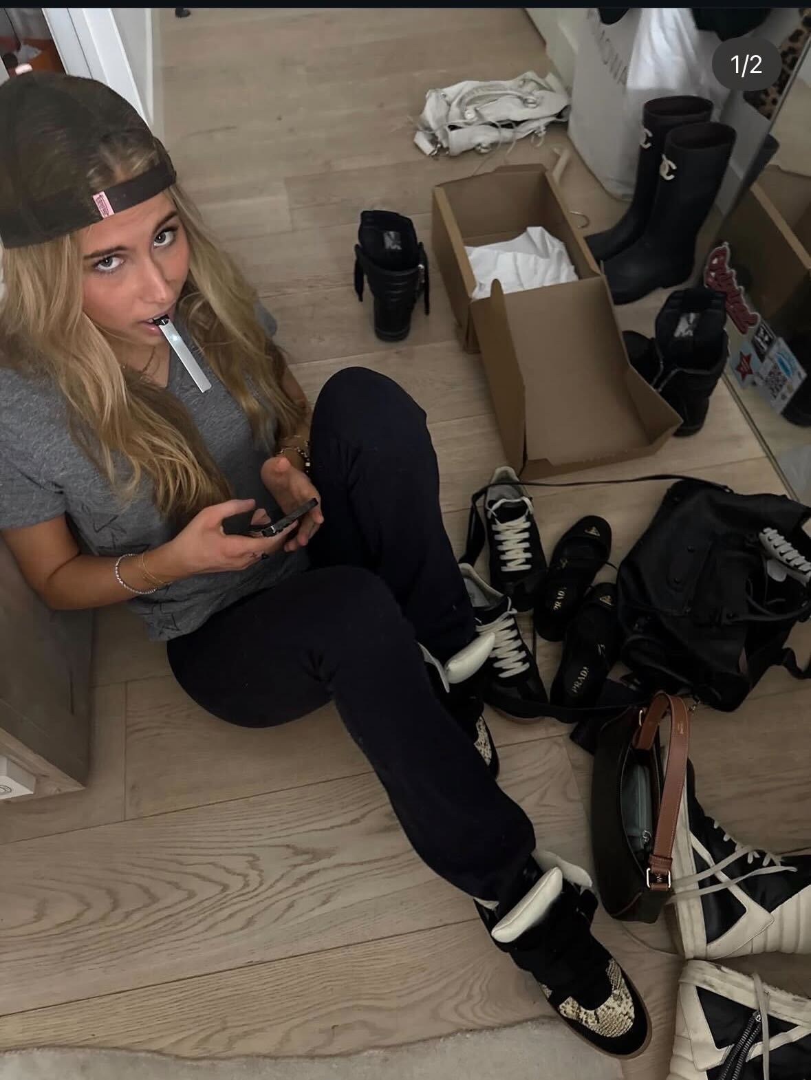 Fashion person Romy Mars wears a tik tok fashion trend 2026. She wears wedged trainers.