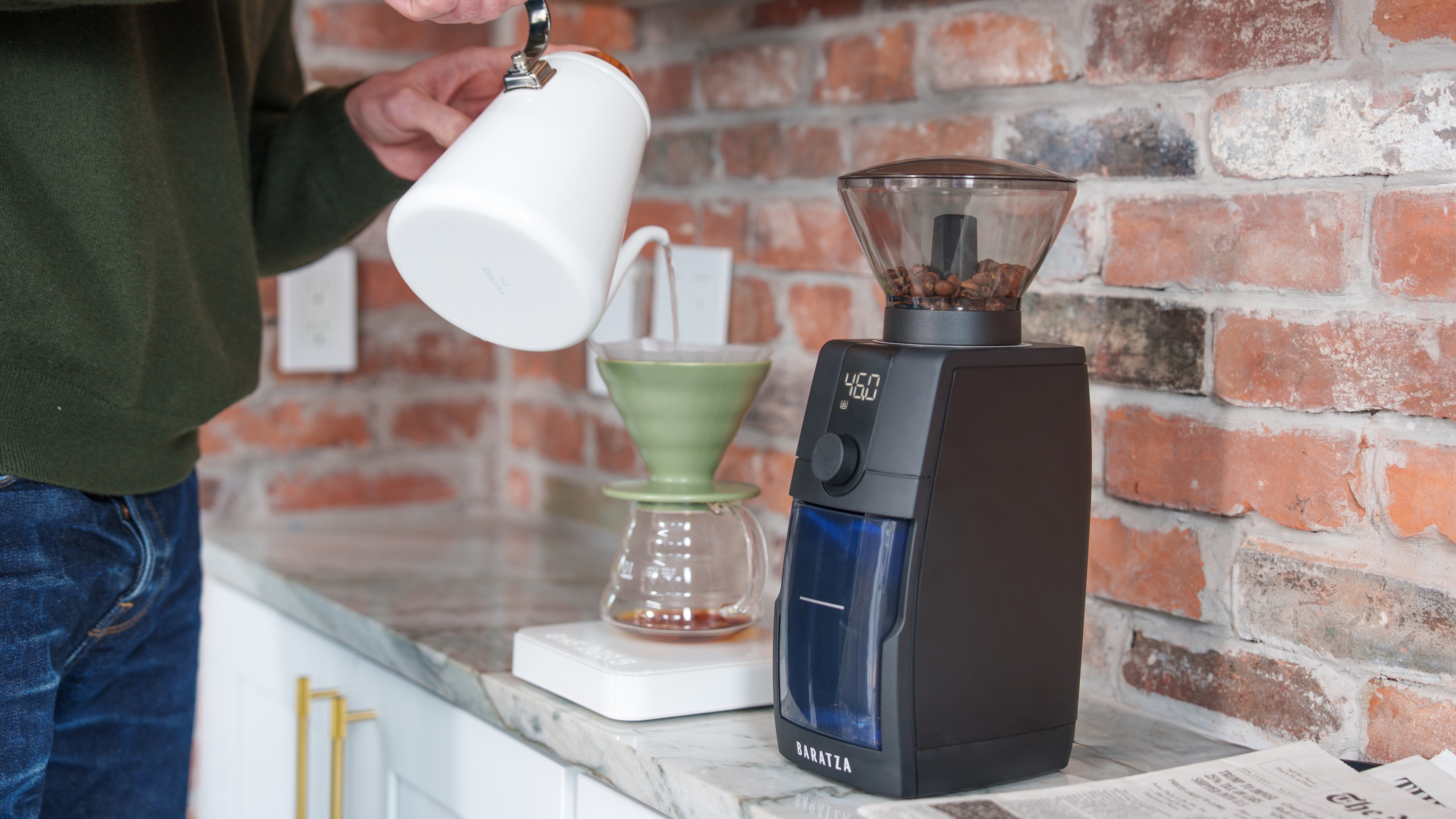 Baratza Encore ESP Pro coffee grinder with person using V60 coffee brewer