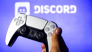 In this photo illustration, a PlayStation 5 controller seen with a Discord logo in the background. 