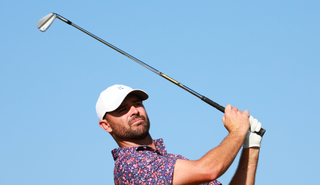 Wesley Bryan hits an iron shot and watches its flight