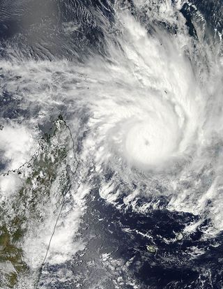 On Jan. 29, 2013, NASA's Aqua satellite captured an image of Cyclone Felleng at 5:14 a.m. EST that showed strong thunderstorms around the center of circulation and a 22 nautical mile-wide eye obscured by high clouds. The western edge of the storm wass approaching Madagascar (left).