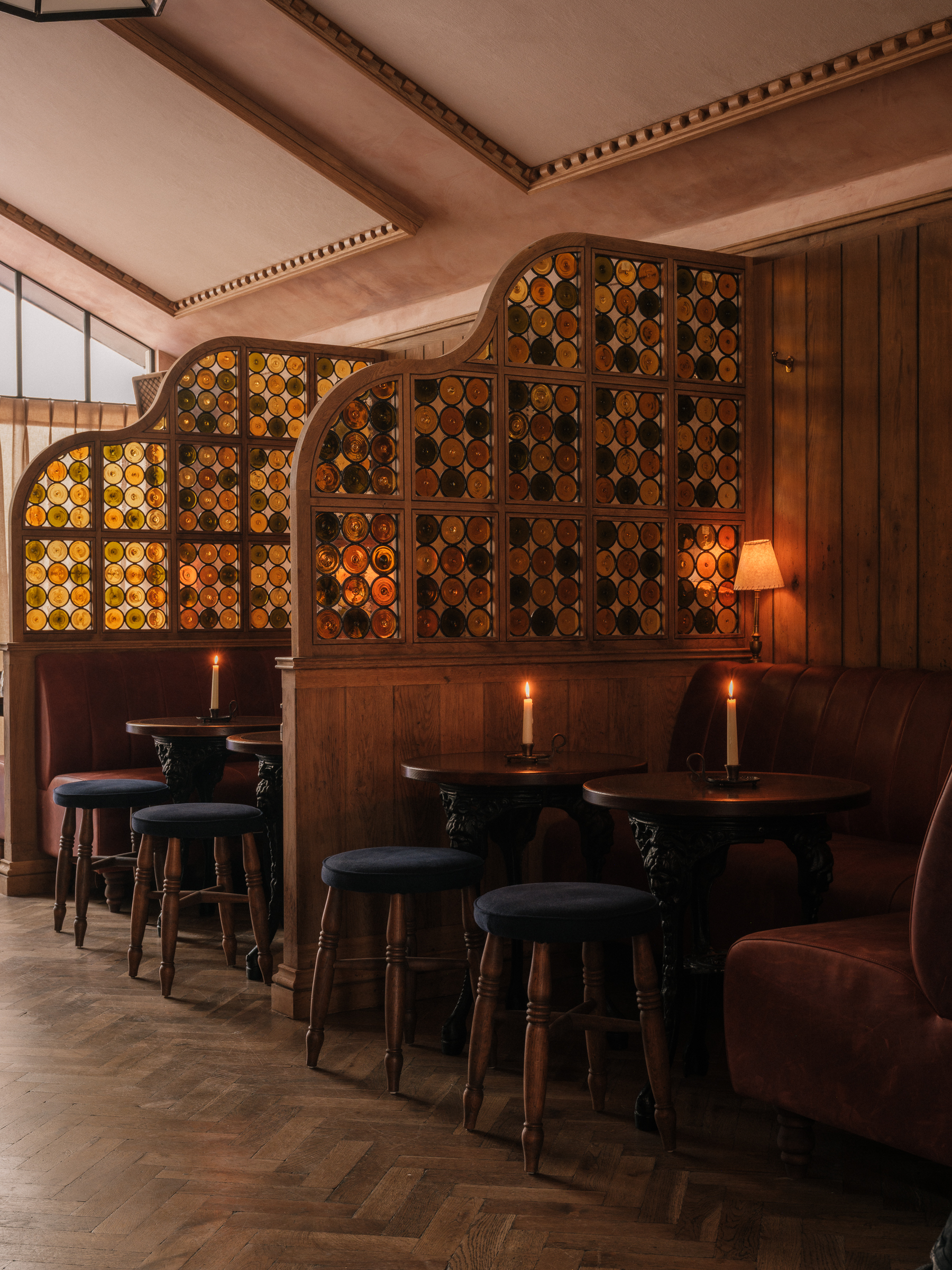 a pub inspired restaurant with interior room dividers using stained glass