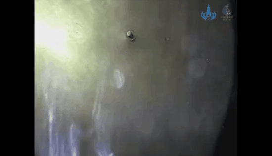 Another view of China's Zhurong rover descent capsule separating from the Tianwen 1 orbiter for a landing on the Red Planet in May 2021.