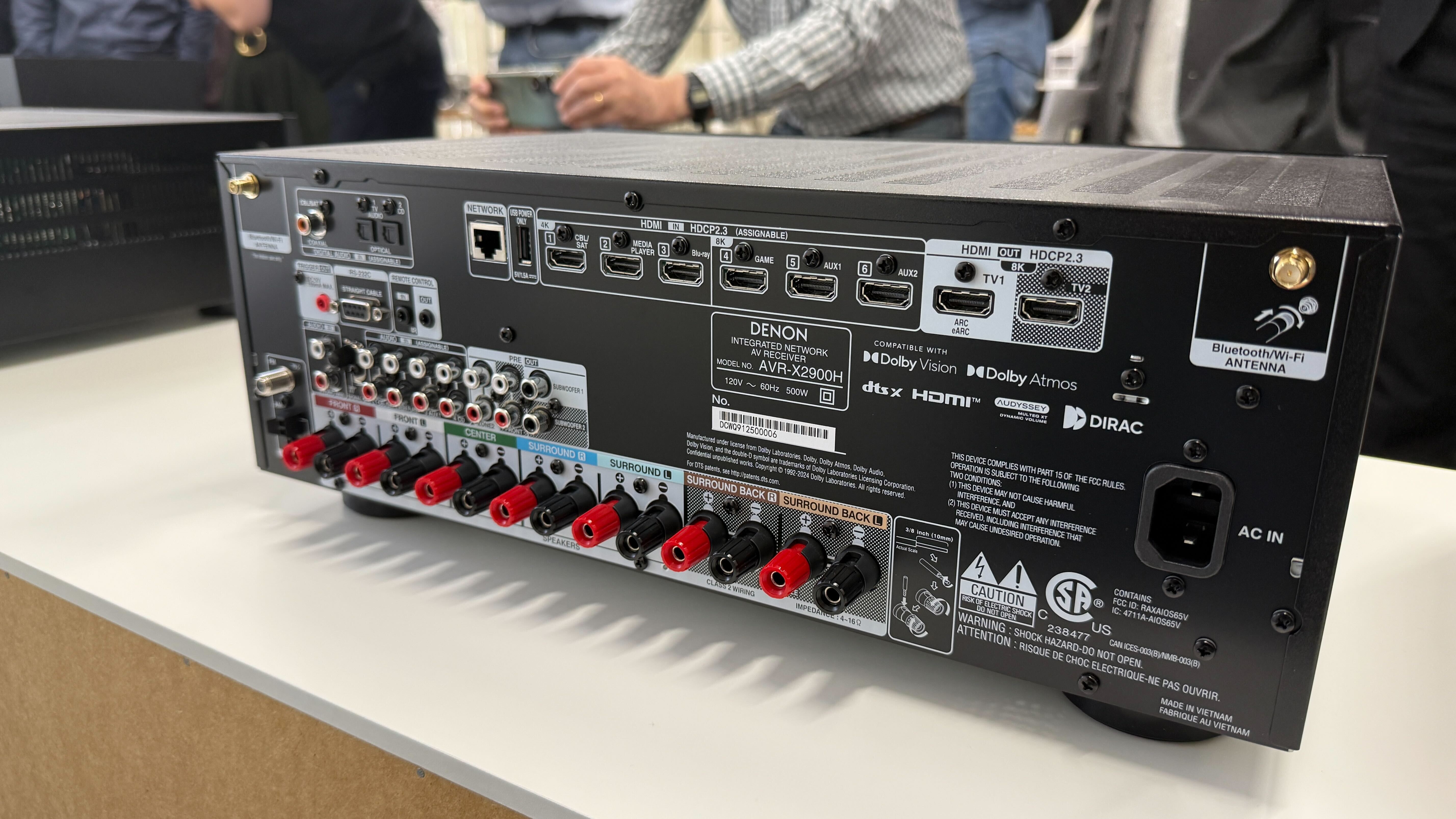 A Denon AVR-X2900H home cinema amplifier on a white table