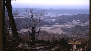 An artist paints the landscape from a spot on the Appalachain Trail in Virginia