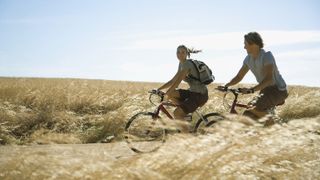 Couple biking through the countryside